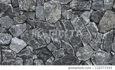 Horizontal background image of a gray irregularly shaped masonry surface Horizontal background image of a gray irregularly shaped masonry surface 110773593