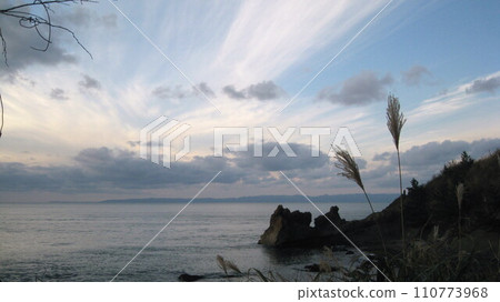 Streak clouds spreading radially above Sadogashima Streak clouds spreading radially above Sadogashima 110773968