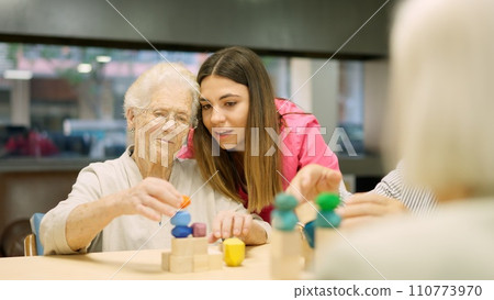 Nurse advising an old woman to resolve a skill game Nurse advising an old woman to resolve a skill game 110773970