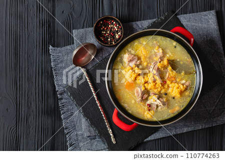 split pea and lentil soup with pork on bones 110774263