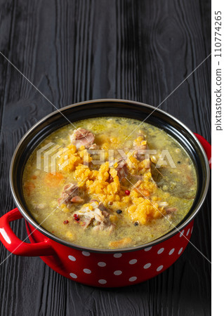 split pea and lentil soup with pork on bones 110774265