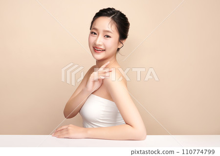 Beautiful young asian woman with clean fresh skin on beige background, Face care, Facial treatment, Cosmetology, beauty and spa, Asian women portrait. 110774799