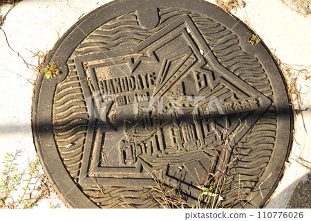 manhole exposed to the sun 110776026