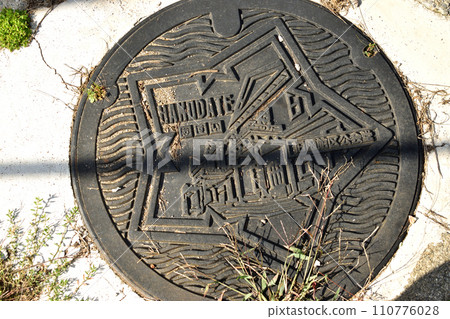 manhole exposed to the sun 110776028