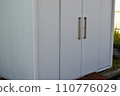 Storage room with white walls and shutters 110776029