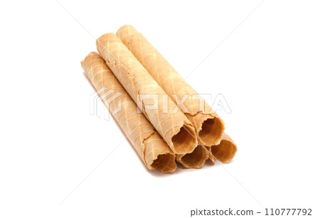 Waffle rolls isolated on the white background Waffle rolls isolated on the white background 110777792