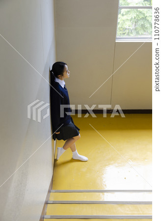 High school girl worried alone 110778636