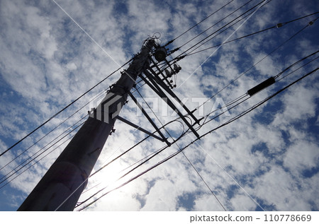 Telephone pole, clouds and sky Telephone pole, clouds and sky 110778669