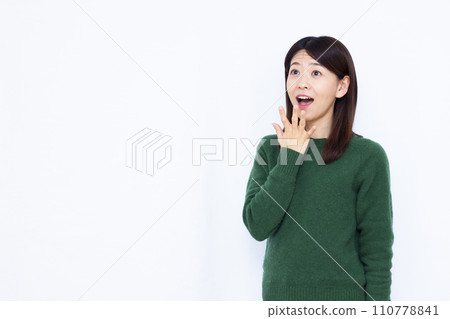 A woman in her 40s who is surprised with a smile A woman in her 40s who is surprised with a smile 110778841