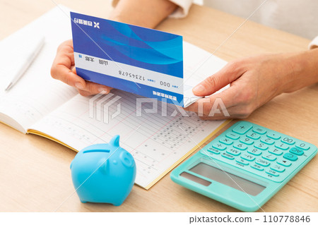 A middle-aged woman keeping a household account book 110778846
