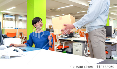 Business woman receiving parcels Business woman receiving parcels 110778960