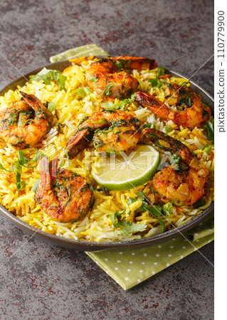 Persian style shrimp rice with lots of herbs and spices closeup on the plate. Vertical Persian style shrimp rice with lots of herbs and spices closeup on the plate. Vertical 110779900