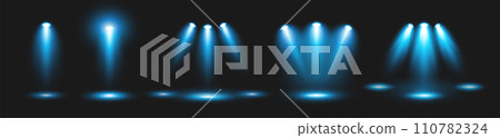 A set of spotlights, lighting the stage with blue light from lighting fixtures on a black background. A set of spotlights, lighting the stage with blue light from lighting fixtures on a black background. 110782324