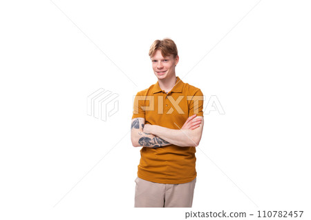 young smart redhead man in yellow t-shirt isolated on white background 110782457
