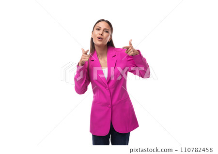 young pretty european woman with straight black hair is dressed in a pink jacket on a white young pretty european woman with straight black hair is dressed in a pink jacket on a white 110782458