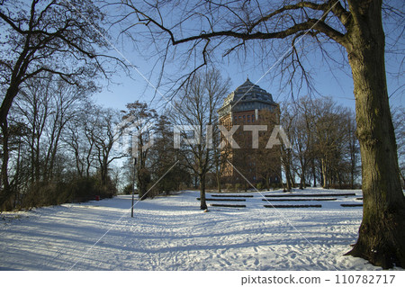 Hamburg in winter, Park around an ancient water tower in Sunny frosty day. High quality photo 110782717