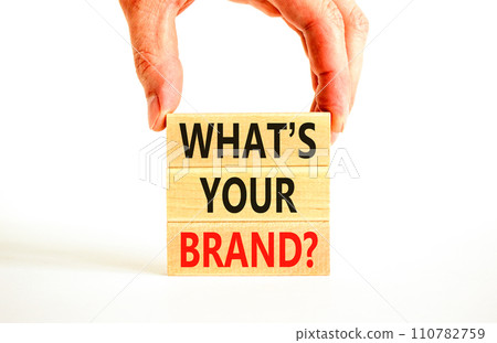 Branding and what is your brand symbol. Concept words What is your brand on beautiful blocks. Beautiful white background. Businessman hand. Business branding what is your brand concept. Copy space. 110782759