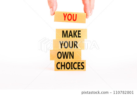 You make your own choice symbol. Concept words You make your own choice on wood blocks. Beautiful white table white background. Businessman hand. Business you make your own choice concept. Copy space. 110782801