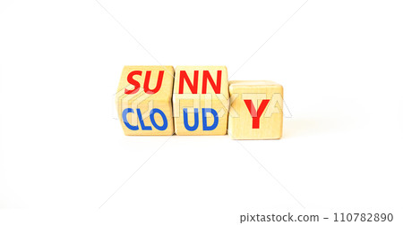 Sunny or cloudy symbol. Concept word Sunny or Cloudy on wooden cubes. Beautiful white table white background. Business lifestyle and sunny or cloudy concept. Copy space. Sunny or cloudy symbol. Concept word Sunny or Cloudy on wooden cubes. Beautiful white table white background. Business lifestyle and sunny or cloudy concept. Copy space. 110782890