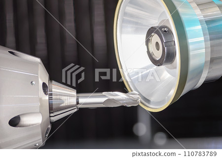 Close up scene the ball nose end mill tool regrinding process on regrinding machine. 110783789