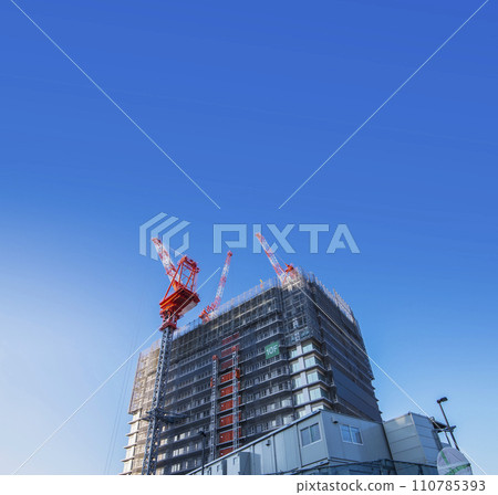Urban landscape with buildings under construction and construction site, crane, condominium construction site, building construction site, blue sky, construction site Urban landscape with buildings under construction and construction site, crane, condominium construction site, building construction site, blue sky, construction site 110785393