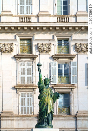 Small replica of the Statue of Liberty on Promenade des Anglais in Nice, France. Statue is made by Bartholdi and is one of several statues which helped him create the huge New York statue 110786619