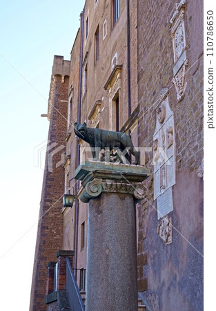 Ancient roman bronze statue of a she-wolf feeding Romulus and Remus the traditional founders of the city and empire of Rome, Italy Ancient roman bronze statue of a she-wolf feeding Romulus and Remus the traditional founders of the city and empire of Rome, Italy 110786650