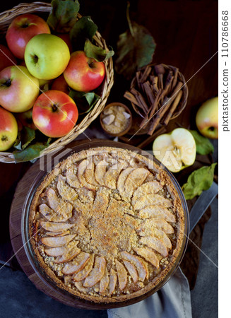 Homemade apple pie on dark rustic background, top view. Classic autumn dessert 110786668
