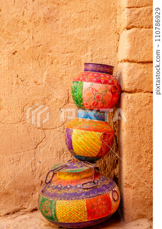Three ornated traditional decorated arabic jars on street of Al Ula, Saudi Arabia 110786929