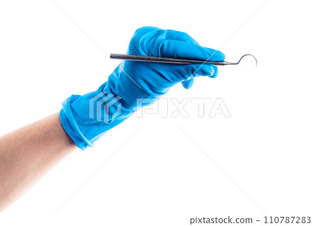 Hand in blue glove holding dental metal stick isolated 110787283