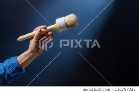 Hand holding brush Hand holding brush 110787322