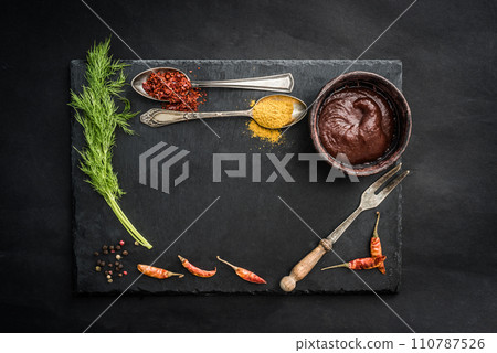 Black slate board with spices 110787526