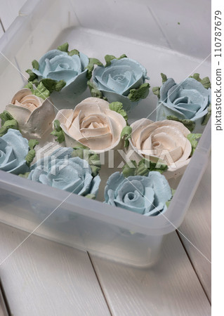 Homemade zephyr spread out on a tray. Flowers from zephyr.  Close-up. 110787679