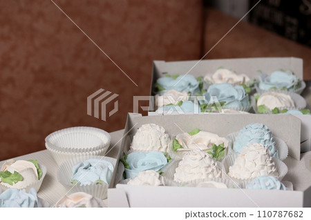 Marshmallows in open gift boxes. Zephyr fir cones and Zephyr flowers. Homemade Zephyr. Marshmallows in open gift boxes. Zephyr fir cones and Zephyr flowers. Homemade Zephyr. 110787682