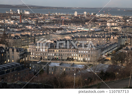 Cityscape view of Edinburgh towards Leith Docks and the Firth of Forth from Calton Hill. 110787713