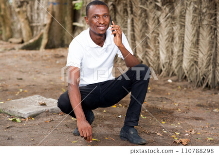 young man talking on the phone 110788298