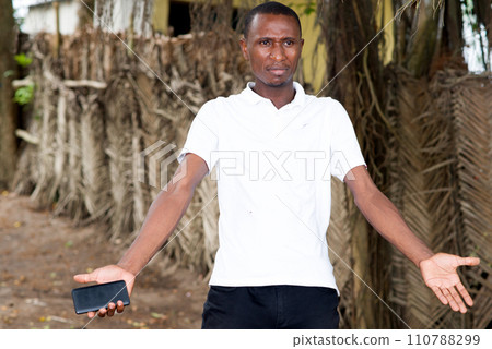 surprised man with mobile phone in hand surprised man with mobile phone in hand 110788299