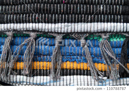 The red knitted fabric is handmade. Background. Hobby. The red knitted fabric is handmade. Background. Hobby. 110788787