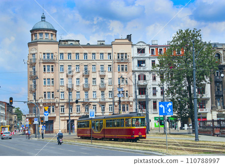 red tram going on street of Lodz. Modern passenger transportation 110788997
