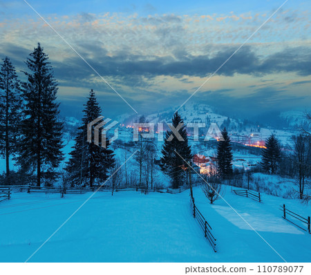 Night winter Carpathian mountain village Zelene, Verkhovyna, Ukraine 110789077