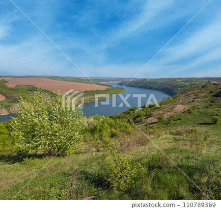 Amazing spring view on the Dnister River Canyon with picturesque rocks, fields, flowers. This place named Shyshkovi Gorby,  Nahoriany, Chernivtsi region, Ukraine. 110789369