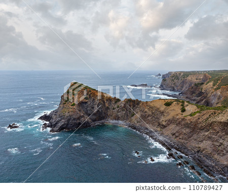 Summer Atlantic ocean rocky coastline (Algarve, Portugal). 110789427