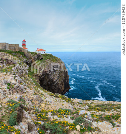 Lighthouse on Cape St. Vincent (is headland in municipality of Sagres, Algarve, southern Portugal). Summer Atlantic coast view. Lighthouse on Cape St. Vincent (is headland in municipality of Sagres, Algarve, southern Portugal). Summer Atlantic coast view. 110789428