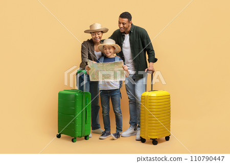 Father, mother and son checking paper map Father, mother and son checking paper map 110790447