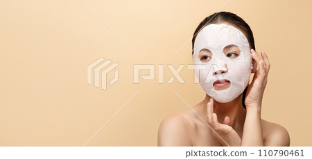 Cheerful millennial chinese naked woman with cosmetics mask, enjoy treatment 110790461