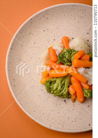Delicious fresh vegetables broccoli, cauliflower, carrots steamed with salt and spices Delicious fresh vegetables broccoli, cauliflower, carrots steamed with salt and spices 110790713
