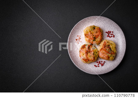 Delicious baked fish fillet with cheese, tomatoes, salt, spices and herbs Delicious baked fish fillet with cheese, tomatoes, salt, spices and herbs 110790778