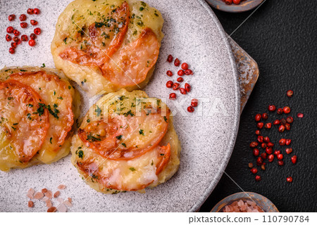 Delicious baked fish fillet with cheese, tomatoes, salt, spices and herbs 110790784