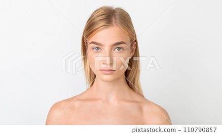 blonde pretty lady looking with calm expression over white background blonde pretty lady looking with calm expression over white background 110790857