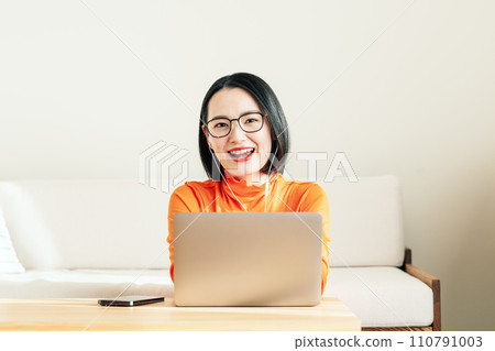 Woman working online Woman working online 110791003